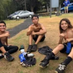 three boys sitting after the Rain forest Ramble fundraiser