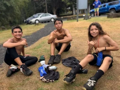 three boys sitting after the Rain forest Ramble fundraiser