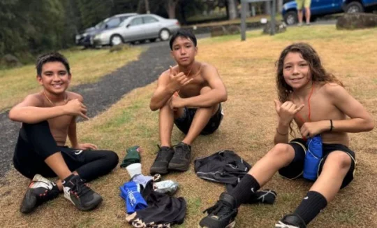 three boys sitting after the Rain forest Ramble fundraiser
