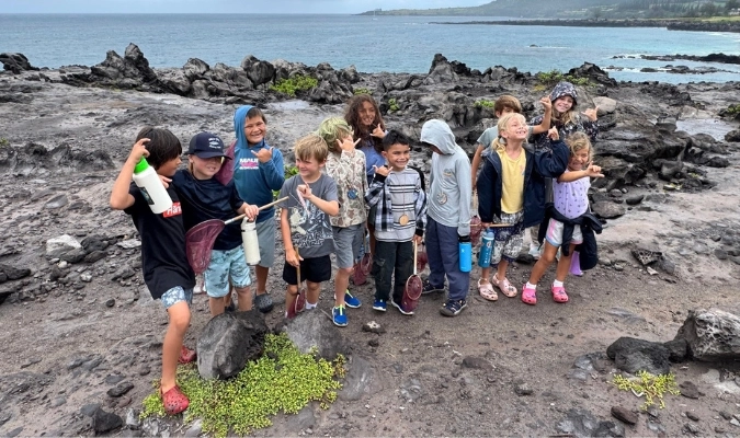 Maui kids at a rocky shore learning and having fun at a Hawai‘i Nature Center program