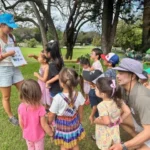 children gathering around instructor