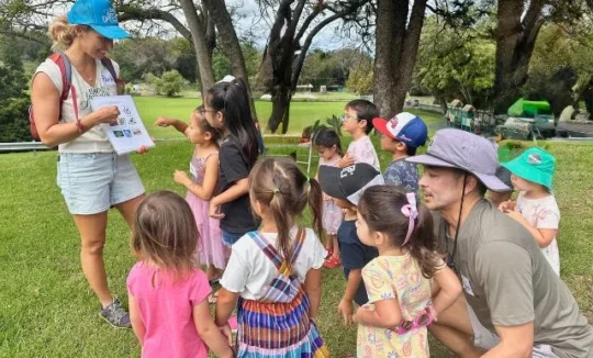 children gathering around instructor