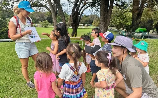 children gathering around instructor